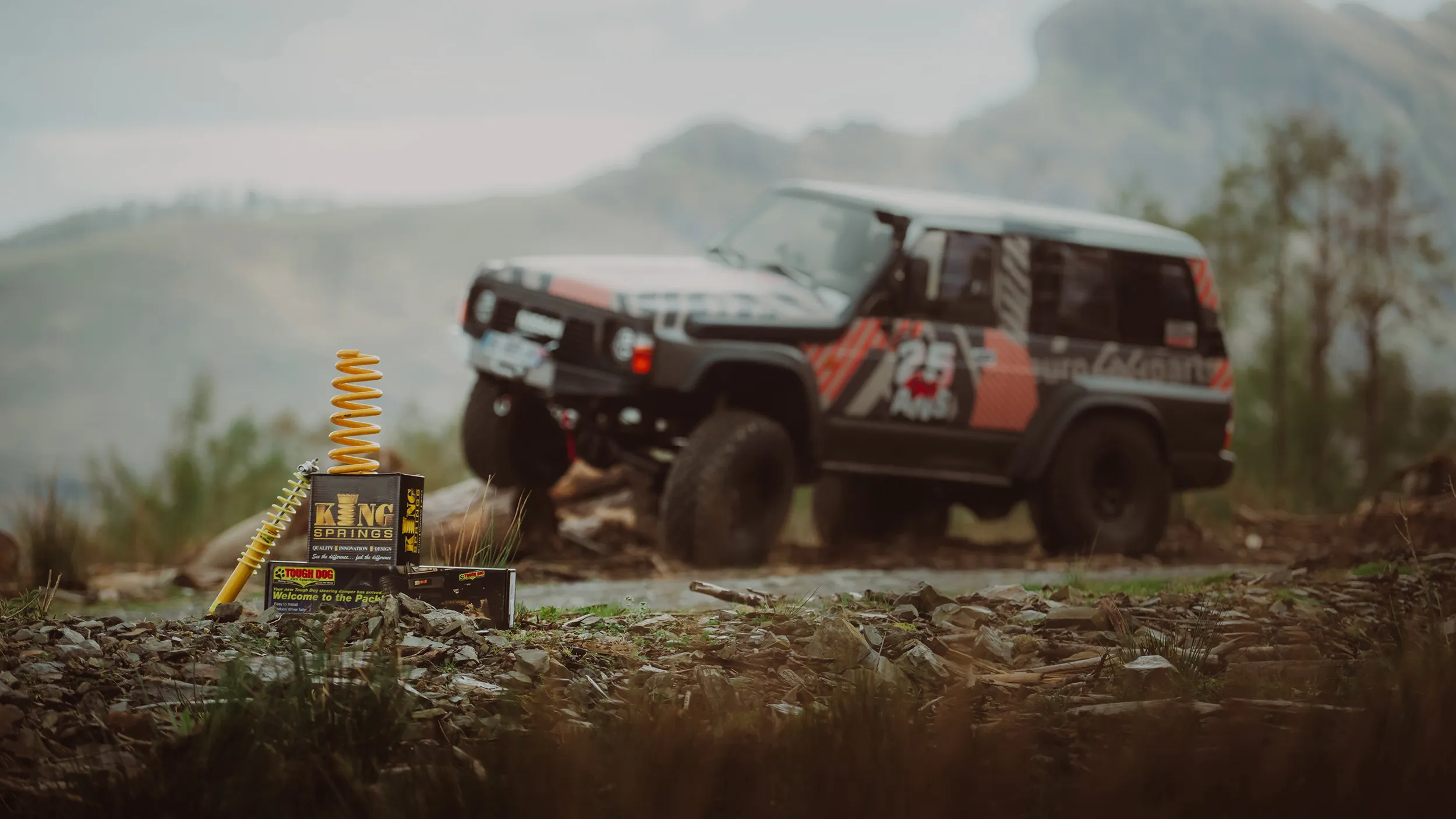 Photo produit de ressorts de suspension King Springs, avec un Nissan Patrol en arrière-plan